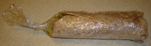 wrap wrapped in plastic wrap with the end twisted to show which end you should open first