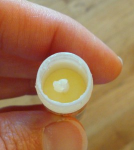 screw the lip balm down to make room to mold melted lip balm