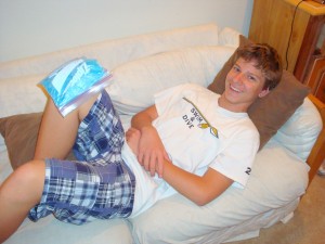 teen with ice pack on knee