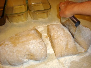 dividing bread dough into loaves