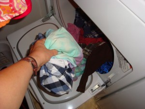 taking laundry out of the dryer