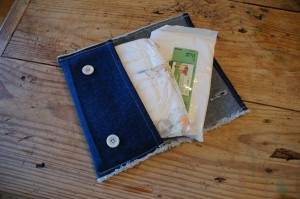Diaper case envelope open showing diaper and wipes