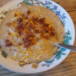 potato, summer squash, cauliflower, onion soup in a bowl