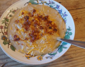 potato, summer squash, cauliflower, onion soup in a bowl